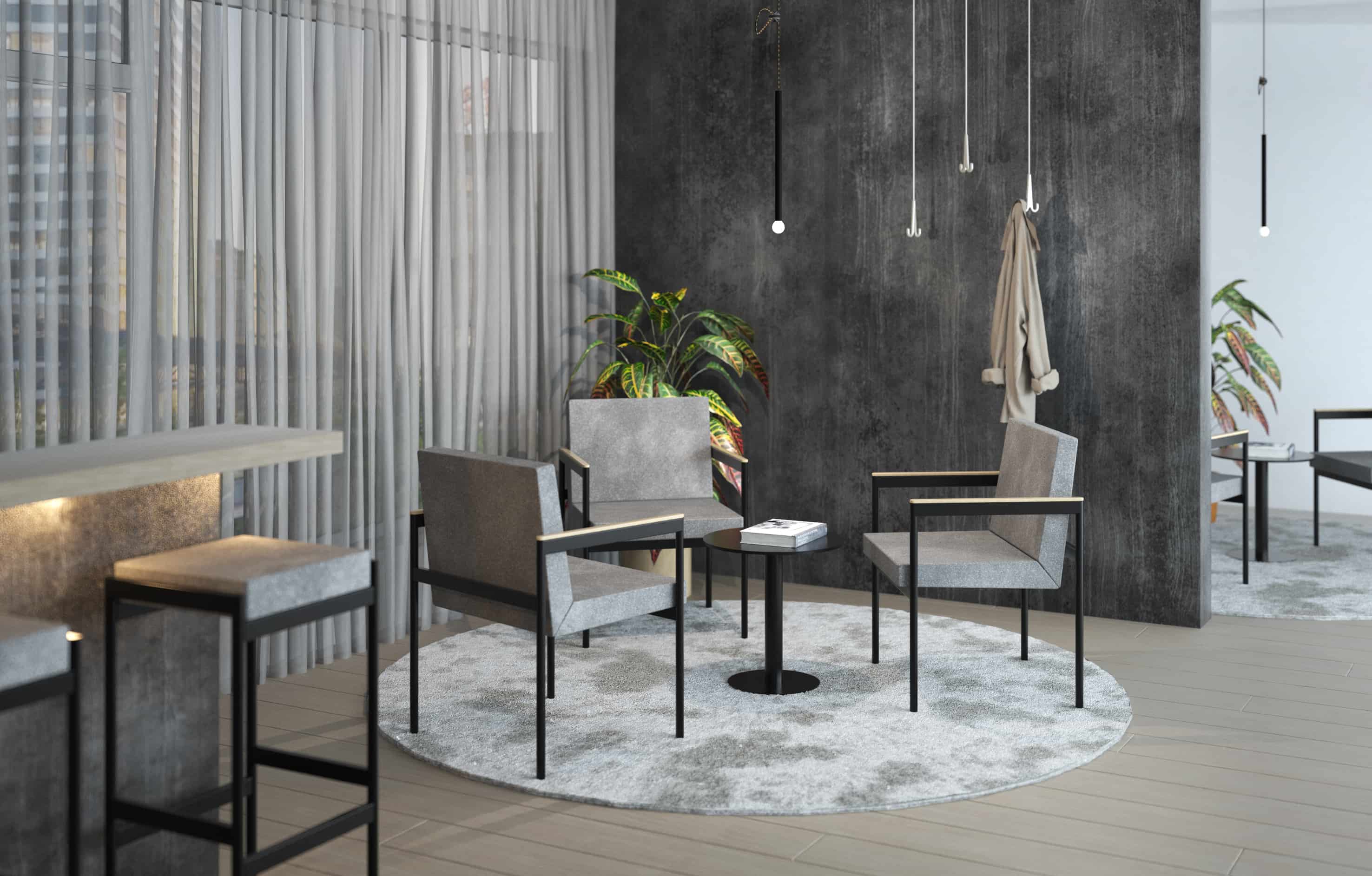 Modern gestaltete Hotel-Lobby mit einer gemütlichen Sitzecke auf einem runden Teppich, grauen Sesseln und minimalistischen Kleiderhaken an einer dunklen Wand in Beton-Optik.